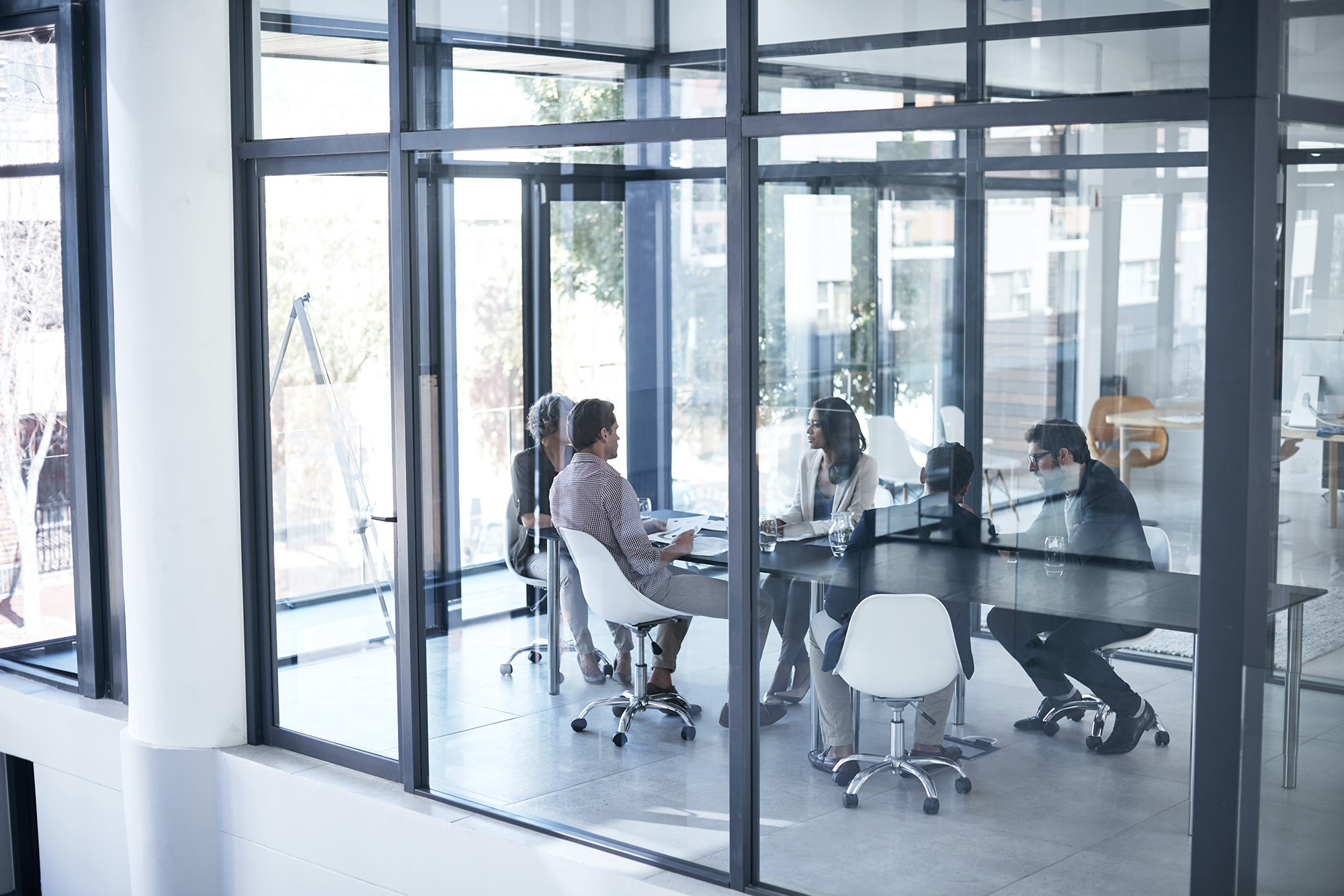 Institutional portfolio managers collaborating in trading room